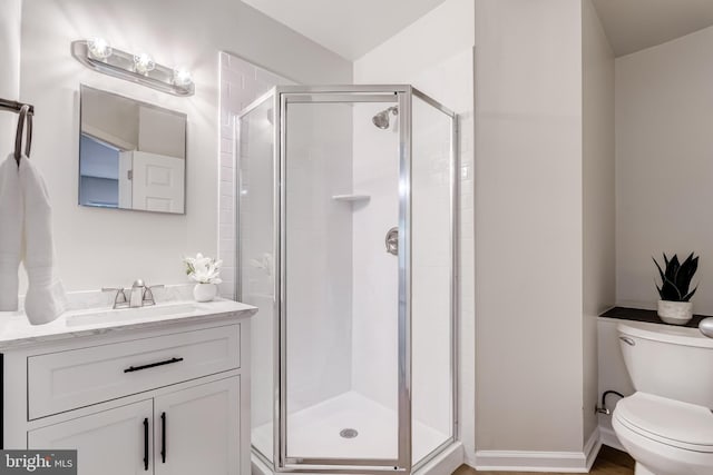 6488 Davis Ford Rd, Manassas, VA 20111 - bathroom featuring toilet, vanity, and a shower stall