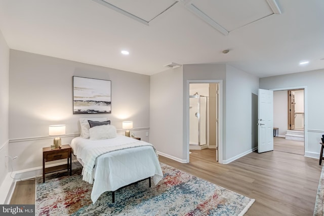 6488 Davis Ford Rd, Manassas, VA 20111 - bedroom with light wood-type flooring, baseboards, recessed lighting, and connected bathroom