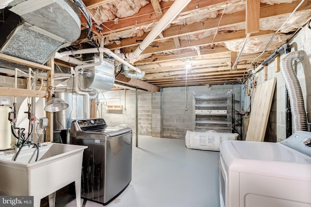 6488 Davis Ford Rd, Manassas, VA 20111 - unfinished below grade area with washing machine and dryer and a sink