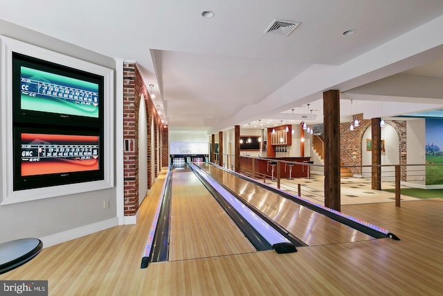 game room featuring visible vents, baseboards, and a bowling alley