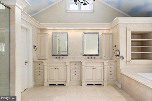 bathroom with double vanity, tile patterned floors, lofted ceiling, and a sink