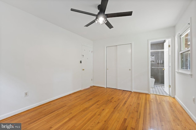 16300 Livingston Rd, Accokeek, MD 20607 - unfurnished bedroom featuring light wood-style flooring, baseboards, a closet, connected bathroom, and a ceiling fan