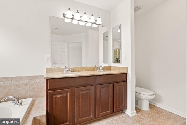 full bathroom with tile patterned flooring, a bath, toilet, and double vanity