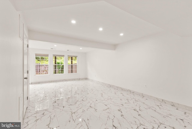unfurnished room with recessed lighting