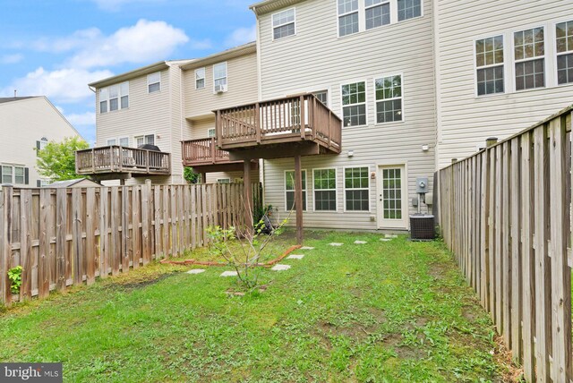 back of property featuring a wooden deck