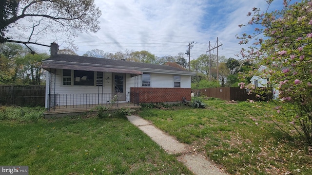 bungalow-style house with covered porch and a chimney