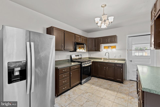 1307 Morling Ave, Baltimore, MD 21211 - kitchen featuring appliances with stainless steel finishes, a sink, a chandelier, dark brown cabinetry, and decorative light fixtures