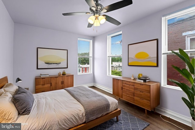 1307 Morling Ave, Baltimore, MD 21211 - bedroom with baseboards, dark wood finished floors, and a ceiling fan