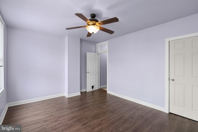 1307 Morling Ave, Baltimore, MD 21211 - spare room with a ceiling fan, dark wood-type flooring, and baseboards