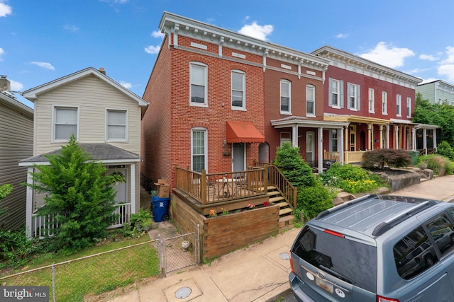 1307 Morling Ave, Baltimore, MD 21211 - view of front of house featuring a gate and brick siding