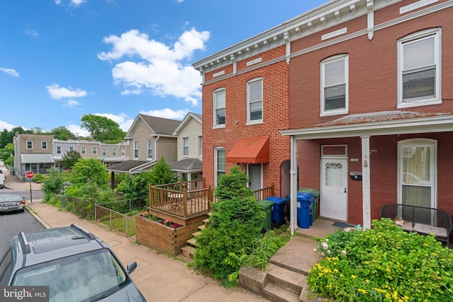1307 Morling Ave, Baltimore, MD 21211 - multi unit property featuring brick siding, a porch, and a residential view