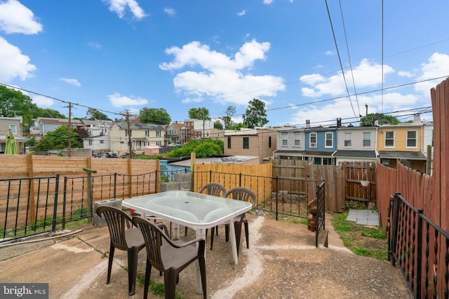 1307 Morling Ave, Baltimore, MD 21211 - fenced backyard with a residential view, outdoor dining area, and a patio