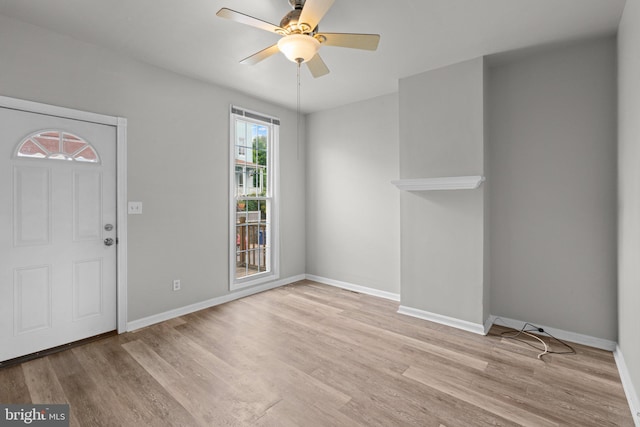 1307 Morling Ave, Baltimore, MD 21211 - foyer with light wood-style floors, a ceiling fan, and baseboards