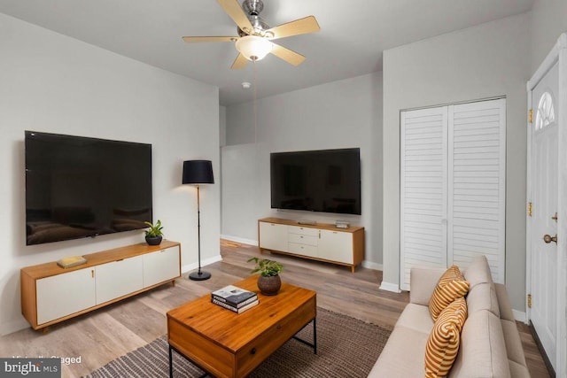 1307 Morling Ave, Baltimore, MD 21211 - living area featuring a ceiling fan, wood finished floors, and baseboards