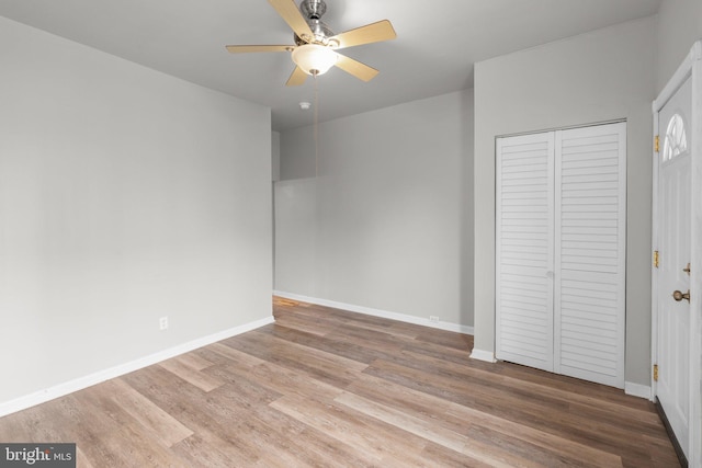 1307 Morling Ave, Baltimore, MD 21211 - unfurnished bedroom featuring wood finished floors, baseboards, a closet, and ceiling fan