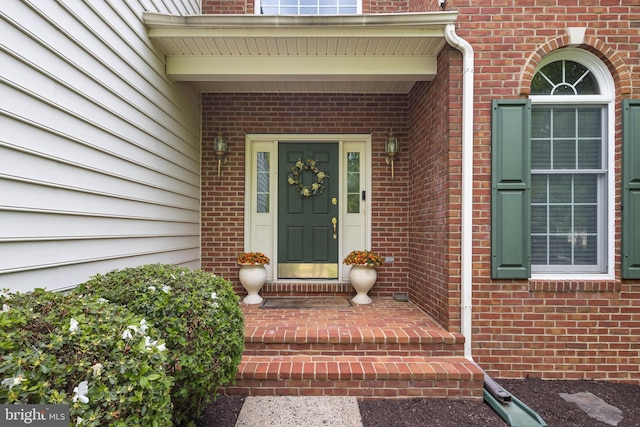 entrance to property with brick siding