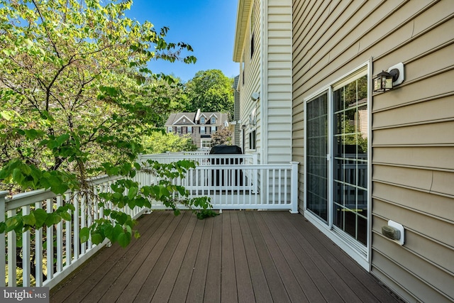wooden deck featuring area for grilling