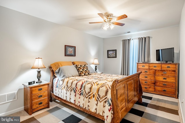 bedroom with baseboards and a ceiling fan