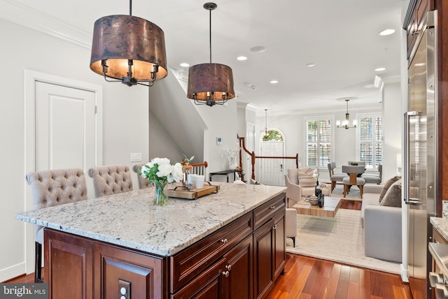 44521/2 Macarthur Blvd NW, Washington, DC 20007 - kitchen featuring a chandelier, light stone counters, ornamental molding, recessed lighting, and open floor plan