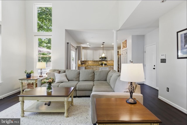43253 Katie Leigh Ct, Ashburn, VA 20147 - living room featuring baseboards, decorative columns, recessed lighting, and dark wood finished floors