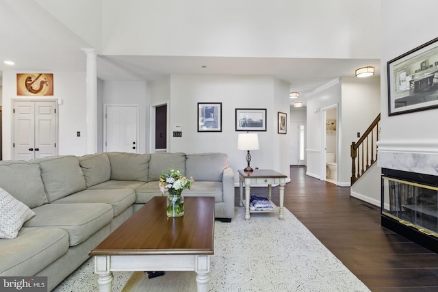 43253 Katie Leigh Ct, Ashburn, VA 20147 - living room with dark wood-style flooring, decorative columns, recessed lighting, stairway, and baseboards