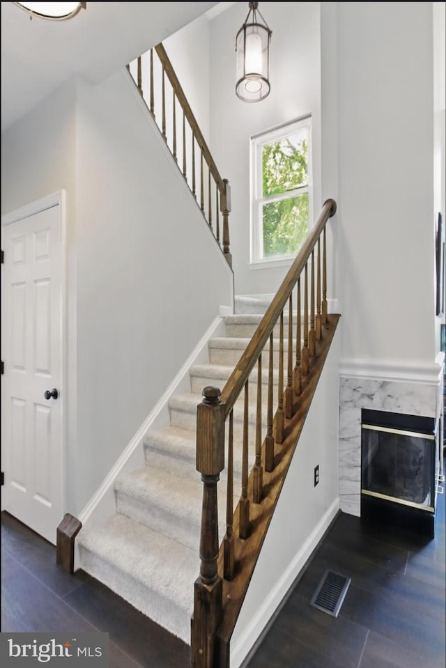 43253 Katie Leigh Ct, Ashburn, VA 20147 - staircase featuring a high end fireplace and baseboards