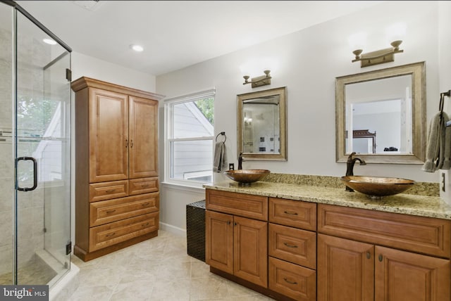 43253 Katie Leigh Ct, Ashburn, VA 20147 - bathroom with a shower stall, double vanity, tile patterned flooring, and recessed lighting