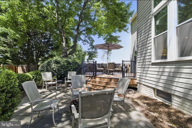43253 Katie Leigh Ct, Ashburn, VA 20147 - view of patio with outdoor dining area, a wooden deck, and fence