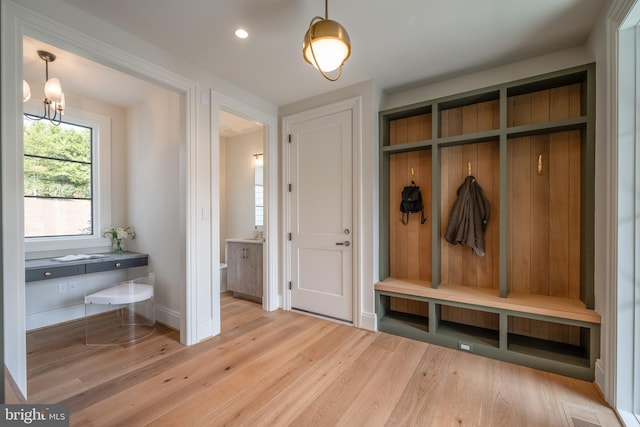 mudroom with wood finished floors, visible vents, baseboards, a chandelier, and recessed lighting