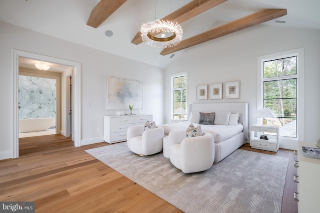 bedroom with a chandelier, light wood-style flooring, lofted ceiling with beams, and baseboards