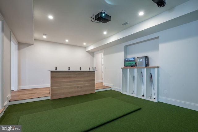 interior space with baseboards, indoor bar, visible vents, and recessed lighting