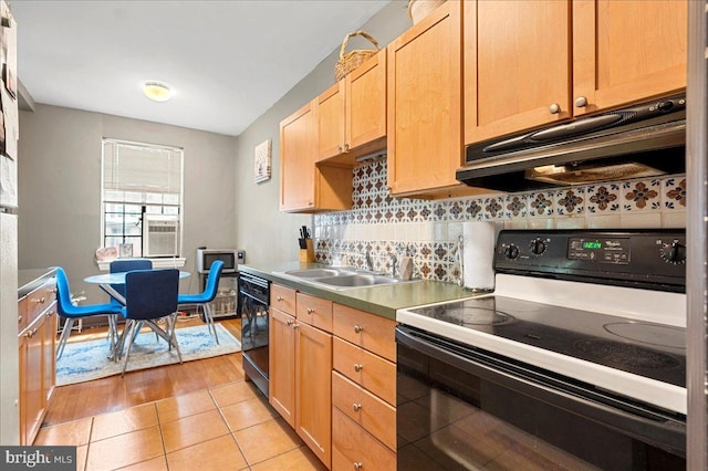 1305 Broom St Unit 105, Wilmington, DE 19806 - kitchen featuring a sink, light brown cabinets, black appliances, under cabinet range hood, and tasteful backsplash