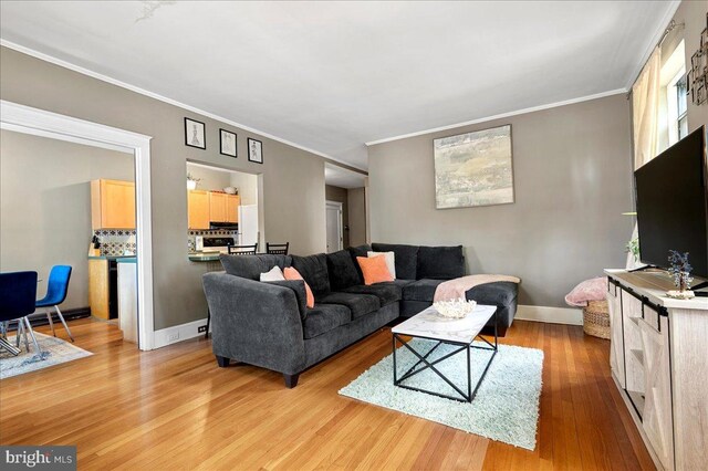 1305 Broom St Unit 105, Wilmington, DE 19806 - living area featuring baseboards, crown molding, and wood finished floors