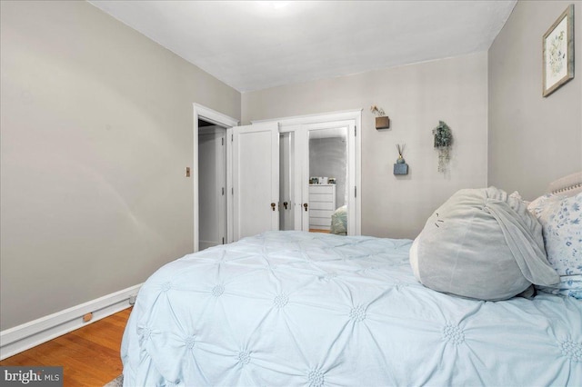 1305 Broom St Unit 105, Wilmington, DE 19806 - bedroom with baseboards and wood finished floors
