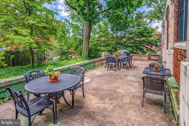 1305 Broom St Unit 105, Wilmington, DE 19806 - view of patio with outdoor dining space and fence