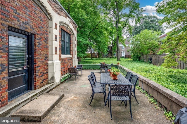 1305 Broom St Unit 105, Wilmington, DE 19806 - view of patio / terrace with fence and outdoor dining space