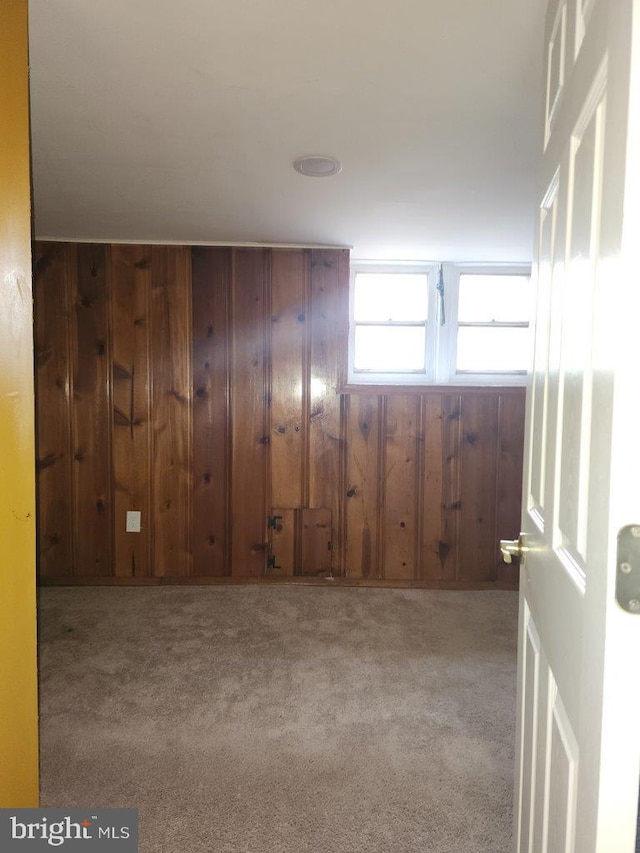 1018 N Bentalou St, Baltimore, MD 21216 - carpeted spare room with wood walls