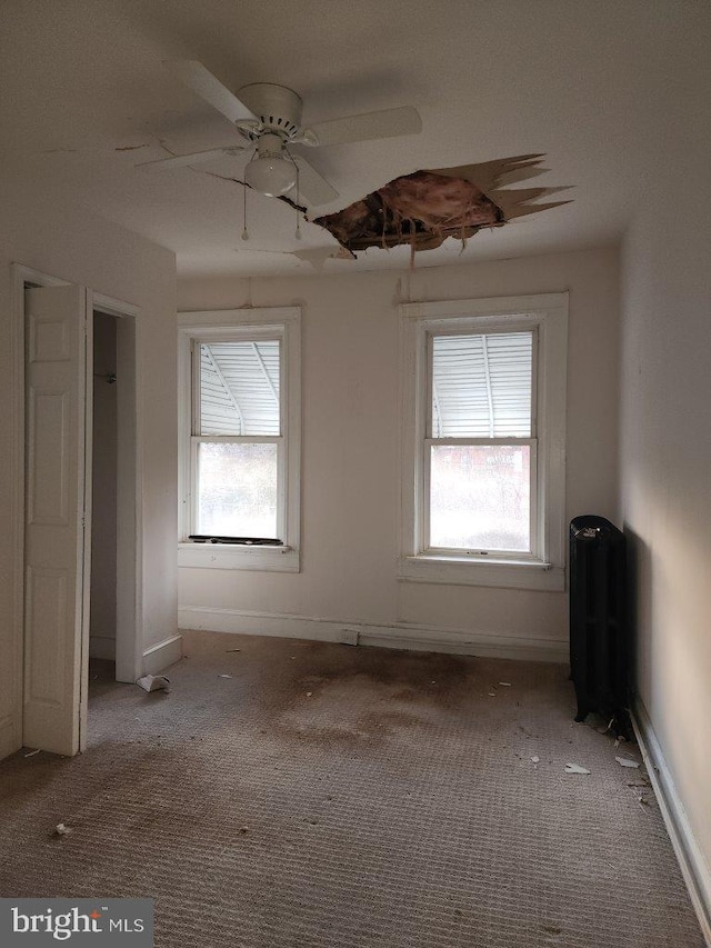 1018 N Bentalou St, Baltimore, MD 21216 - carpeted empty room featuring baseboards and ceiling fan