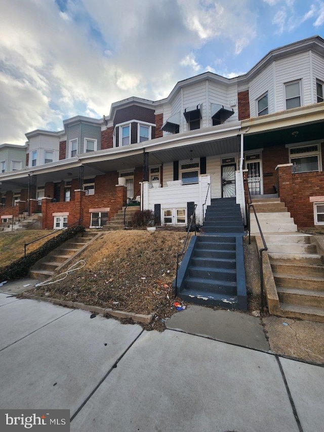 1018 N Bentalou St, Baltimore, MD 21216 - multi unit property featuring stairway and covered porch