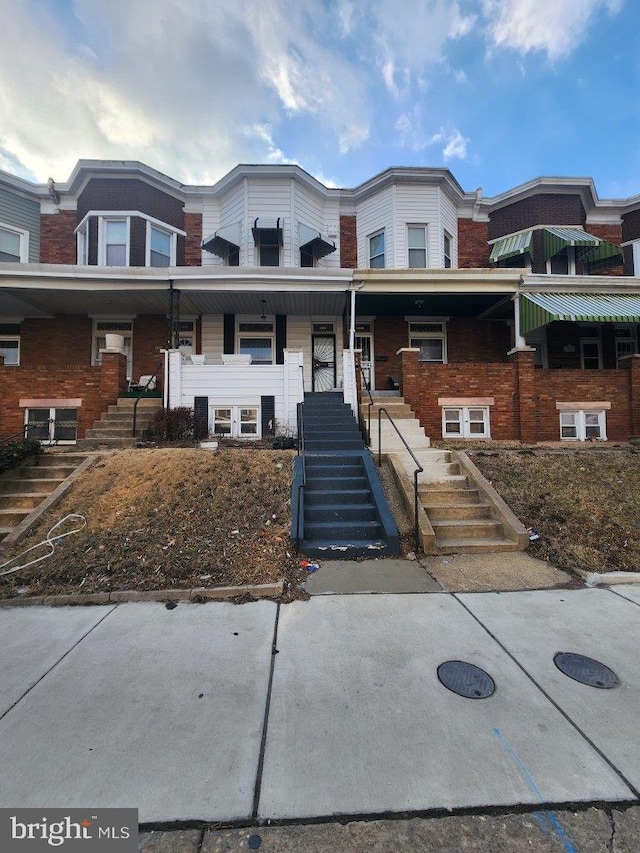 1018 N Bentalou St, Baltimore, MD 21216 - multi unit property featuring a porch and stairs