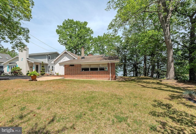 424 Alameda Pkwy, Arnold, MD 21012 - view of front of house with brick siding and a front lawn