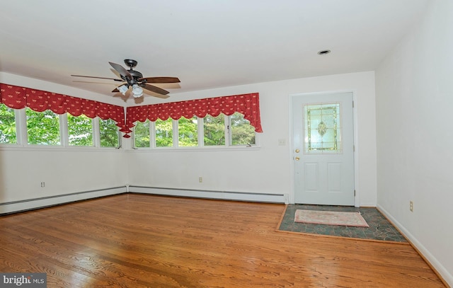 424 Alameda Pkwy, Arnold, MD 21012 - foyer entrance with baseboard heating, ceiling fan, wood finished floors, and baseboards