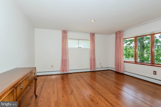 424 Alameda Pkwy, Arnold, MD 21012 - spare room with wood finished floors, recessed lighting, and a baseboard heating unit
