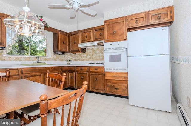 424 Alameda Pkwy, Arnold, MD 21012 - kitchen featuring white appliances, a baseboard heating unit, a sink, wallpapered walls, and under cabinet range hood