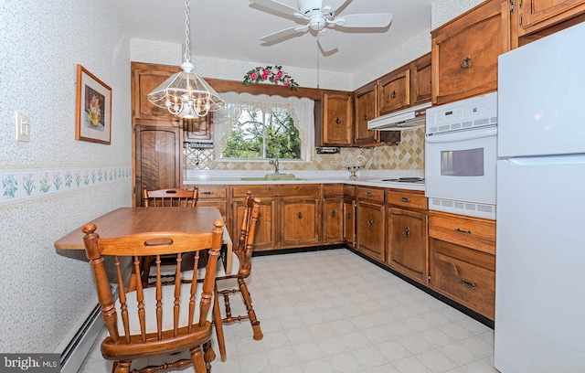 424 Alameda Pkwy, Arnold, MD 21012 - kitchen with white appliances, wallpapered walls, a sink, brown cabinets, and a chandelier