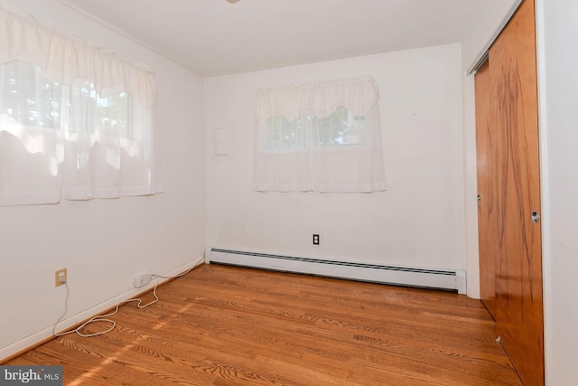 424 Alameda Pkwy, Arnold, MD 21012 - unfurnished room featuring baseboard heating and wood finished floors