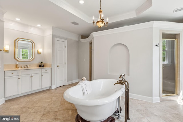 bathroom featuring recessed lighting, ornamental molding, visible vents, vanity, and a soaking tub