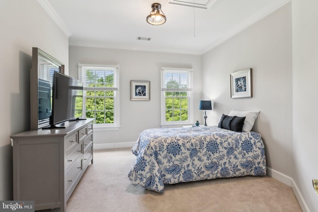 bedroom with light colored carpet, attic access, visible vents, and crown molding