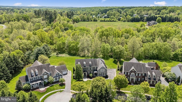 drone / aerial view featuring a view of trees
