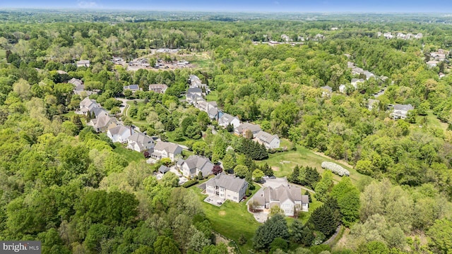 aerial view with a residential view and a view of trees